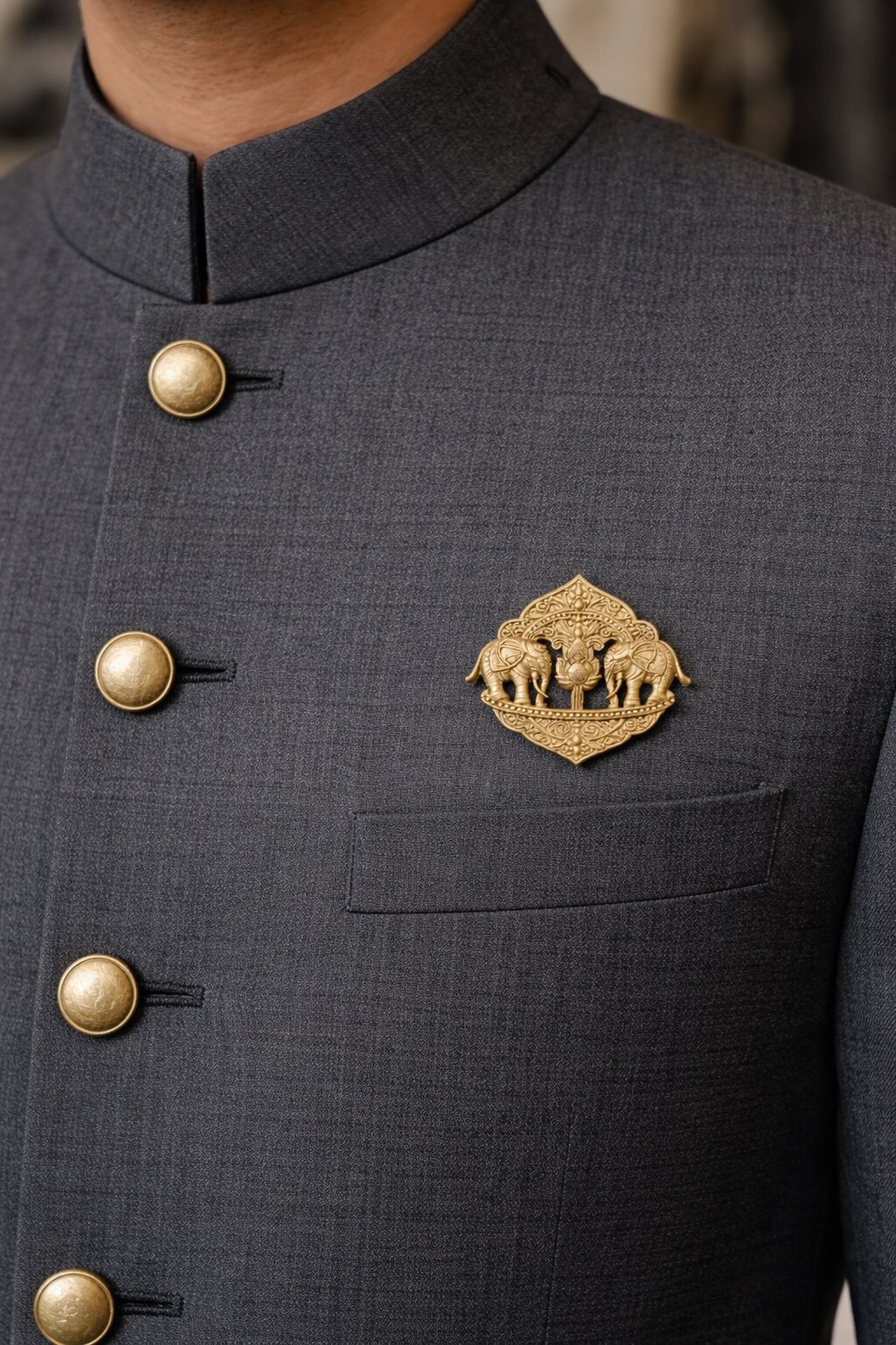 Antique gold twin elephant brooch featuring a central lotus motif and intricate traditional ornamental detailing, ideal for weddings and festive wear.