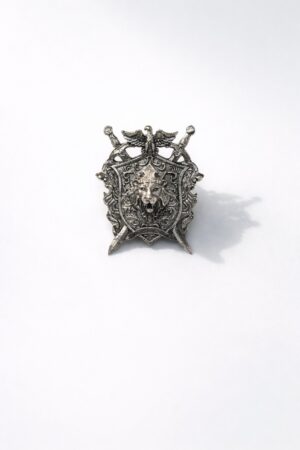 Silver-tone lion crest shield brooch featuring a crowned lion emblem, crossed swords, and intricate royal detailing, perfect for wedding and formal wear.