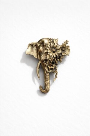 Antique gold elephant brooch featuring intricate floral detailing and vintage botanical accents, ideal for weddings and festive wear.