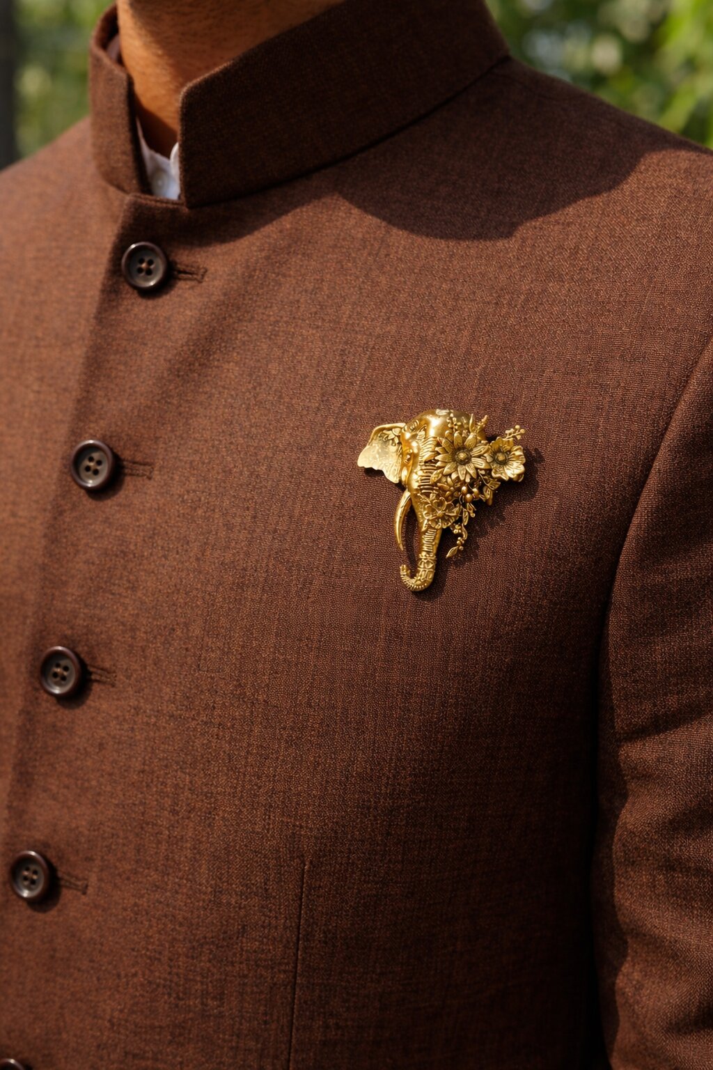 Antique gold elephant brooch featuring intricate floral detailing and elegant botanical motifs, perfect for weddings and festive occasions.