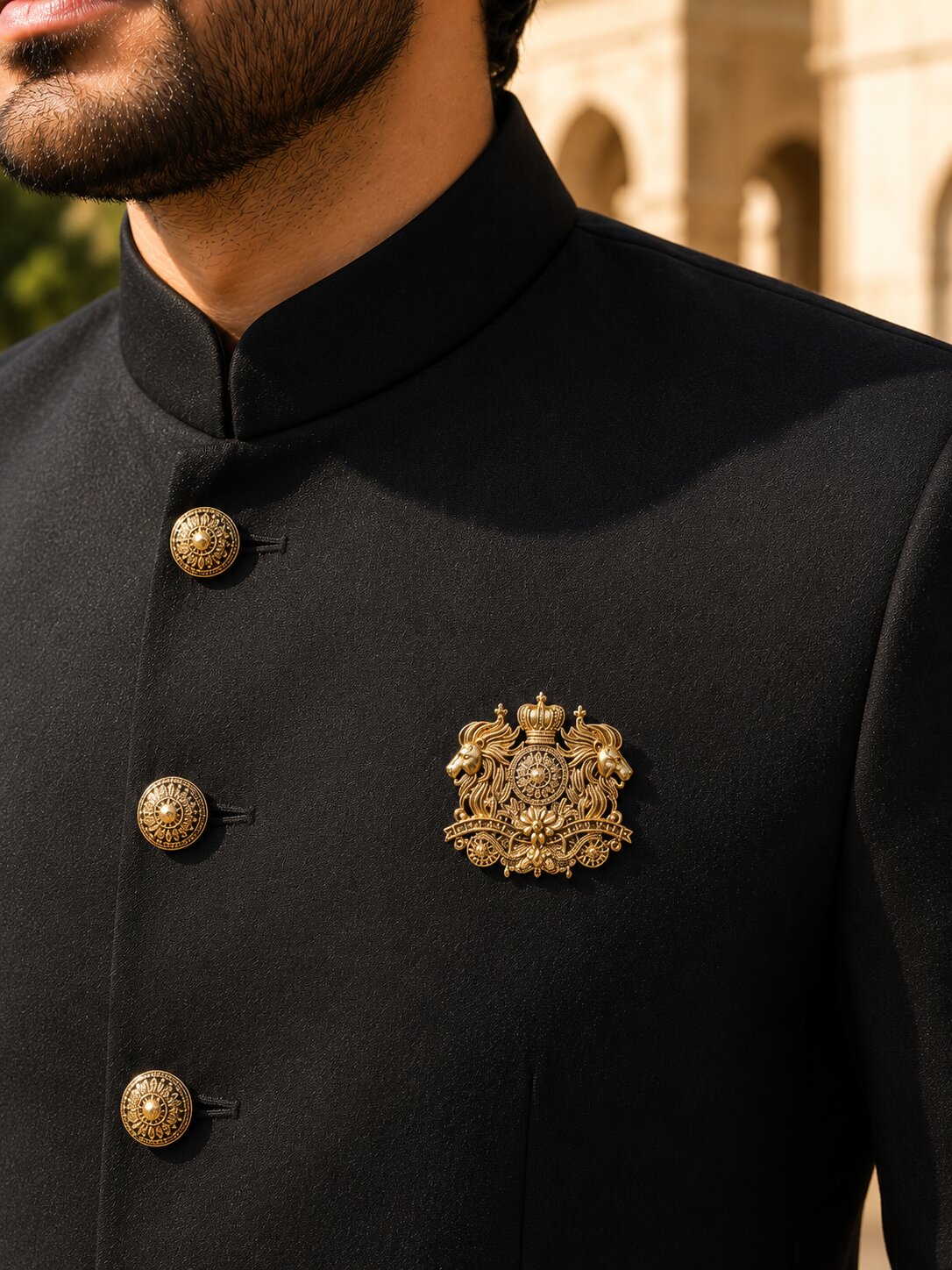 Gold-tone royal lion crest brooch featuring twin lions, a crown emblem, and intricate ornamental detailing, ideal for wedding and ceremonial wear.