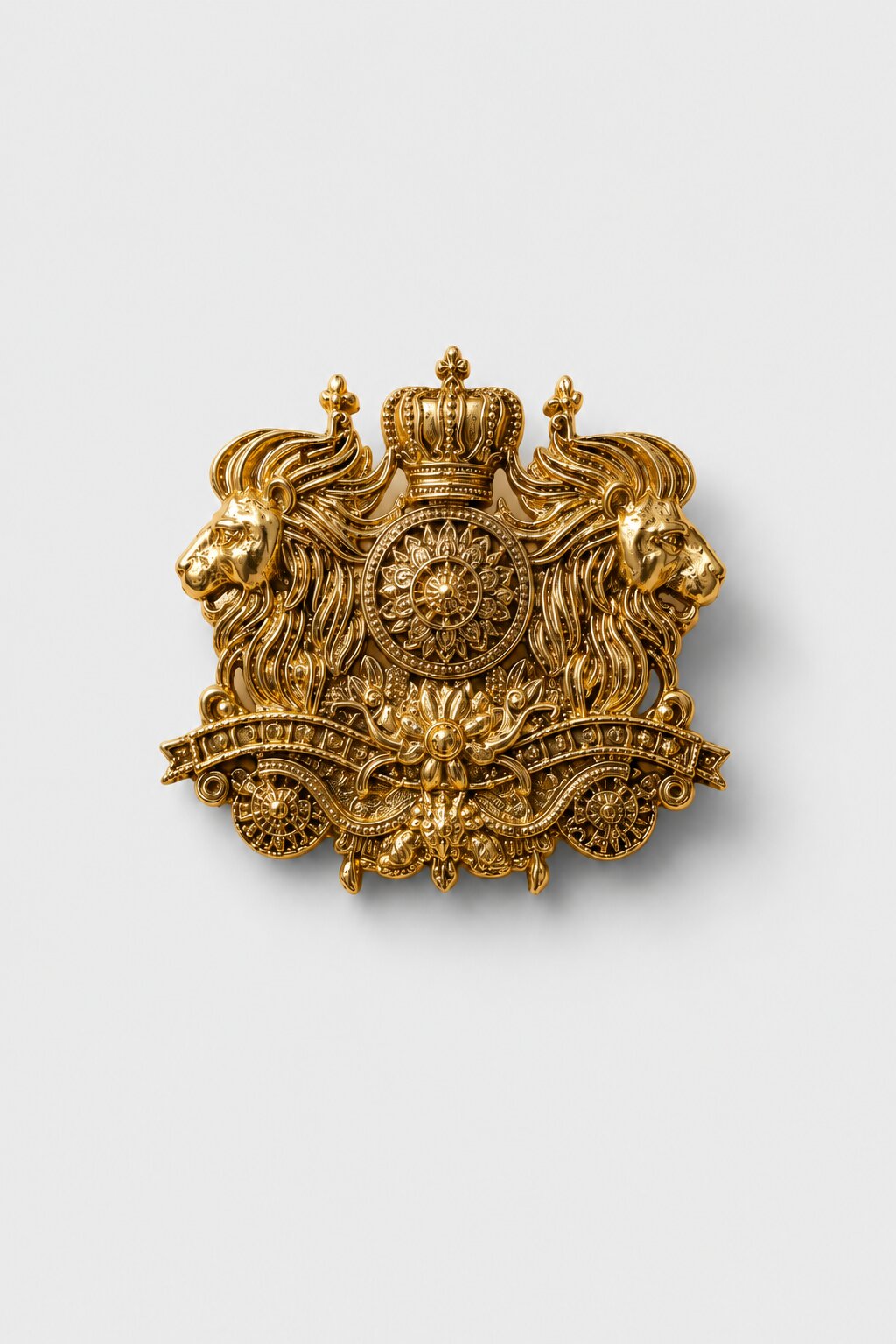 Gold-tone royal lion crest brooch featuring twin lions, a crown emblem, and intricate ornamental detailing, ideal for wedding and ceremonial wear.
