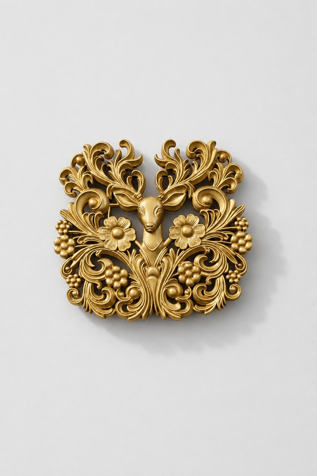 Antique gold deer brooch featuring intricate floral scrollwork, flower motifs, and elegant ornamental detailing, ideal for weddings and festive wear.