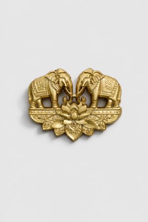Gold-tone twin elephant brooch featuring two facing elephants with a lotus flower centerpiece and intricate traditional detailing, perfect for weddings and festive wear.