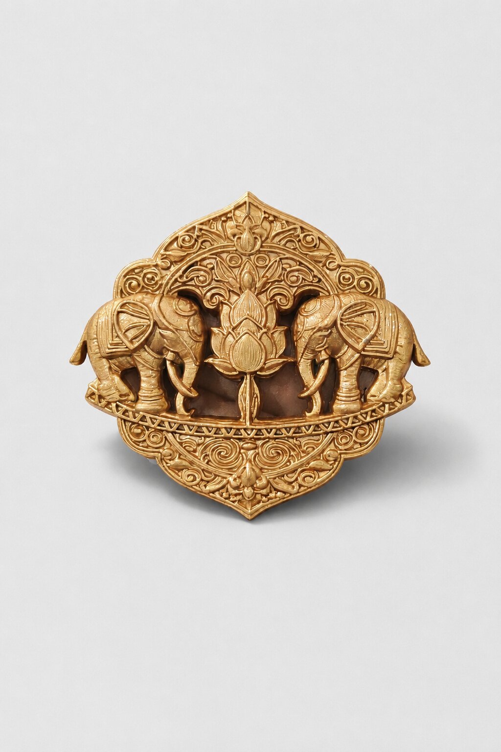 Antique gold twin elephant brooch featuring a central lotus motif and intricate traditional ornamental detailing, ideal for weddings and festive wear.