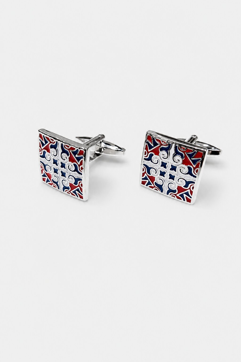 Square silver-tone cufflinks with red, blue, and white decorative enamel pattern for men's formal shirts.