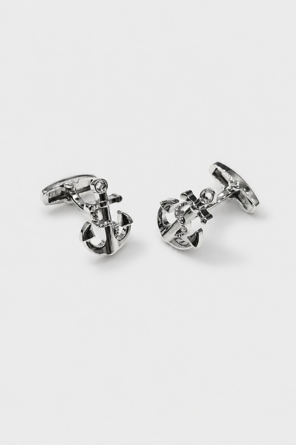 Silver anchor-shaped cufflinks with nautical rope detailing for men's formal dress shirts.