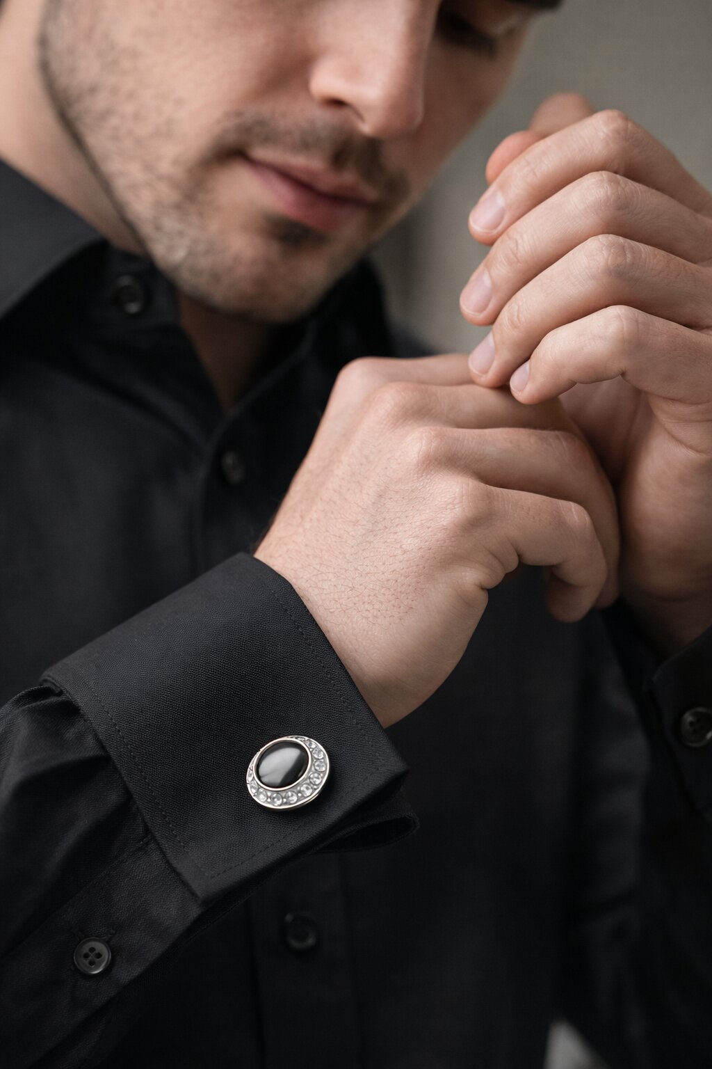 Silver-tone round cufflinks with black center stone and crystal-studded border for men's formal shirts.