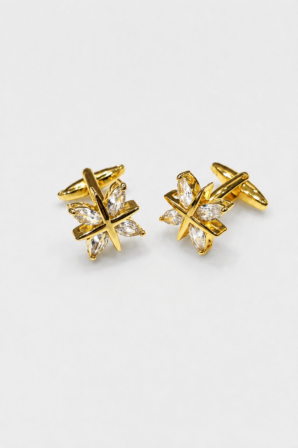 Gold star-shaped cufflinks with clear crystal accents for men's formal shirts.