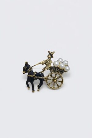 Antique gold-tone horse cart brooch with black enamel horse and pearl cargo details.