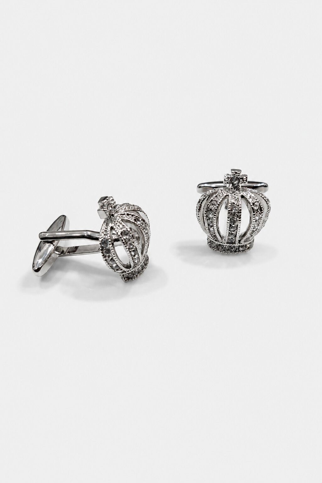 Silver crown cufflinks embellished with sparkling crystals for men's formal wear.