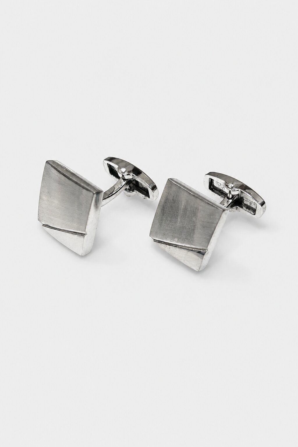 Brushed silver square cufflinks with minimalist geometric design for men's formal dress shirts.