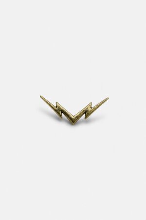 Gold-tone lightning bolt brooch with sleek minimalist zigzag design and metallic finish.