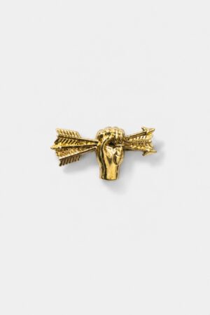 Gold-tone collar brooch featuring a hand holding an arrow with intricate decorative detailing.