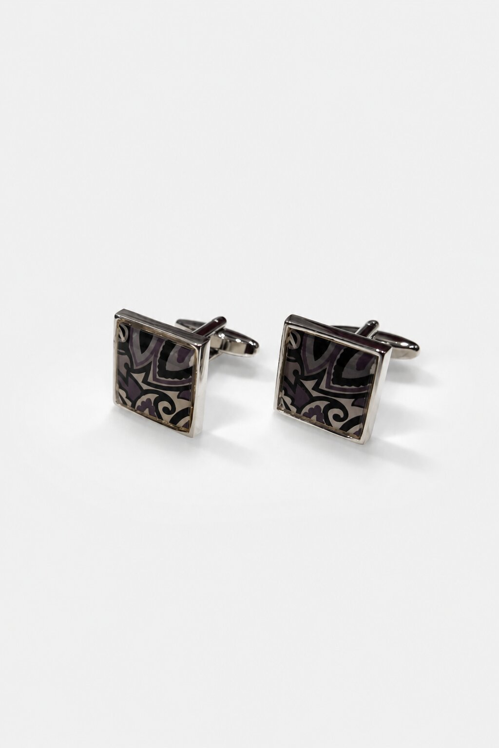 Square silver-tone cufflinks with abstract purple, black, and gold decorative pattern for men's formal shirts.