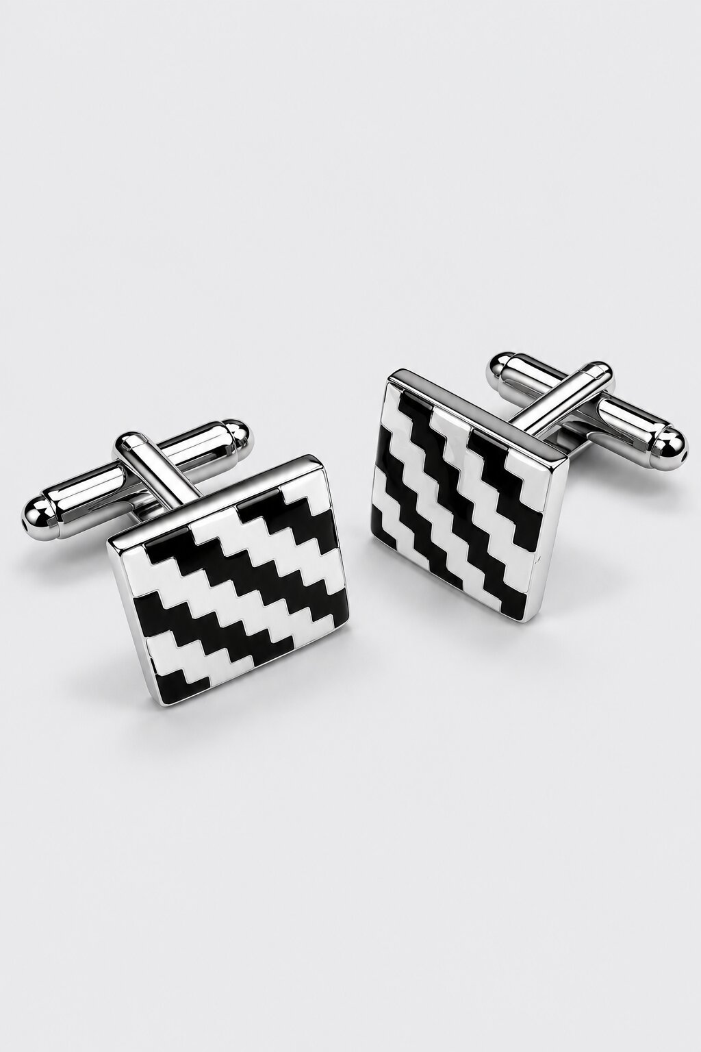 Square silver-tone cufflinks with black and white geometric zigzag pattern for men's formal shirts.