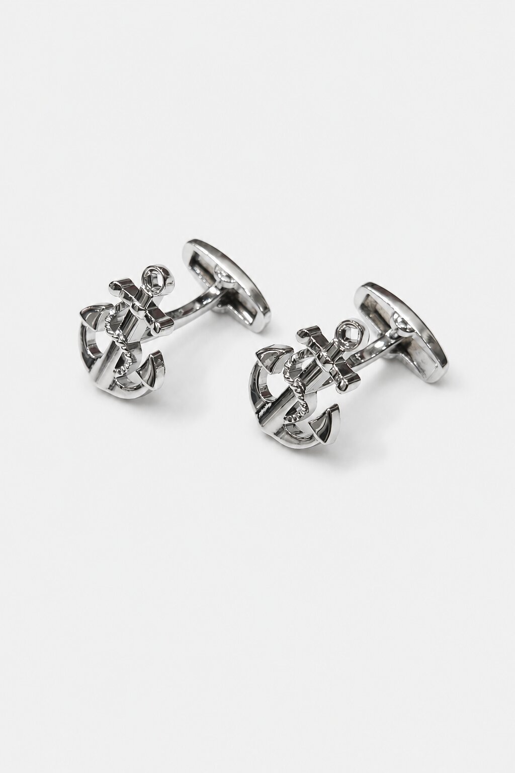 Silver anchor-shaped cufflinks with nautical rope detailing for men's formal dress shirts.
