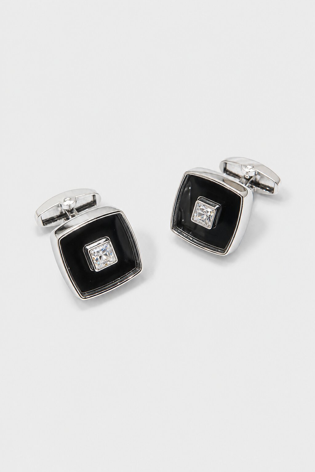 Silver square cufflinks with black enamel center and crystal accent for men's formal shirts.