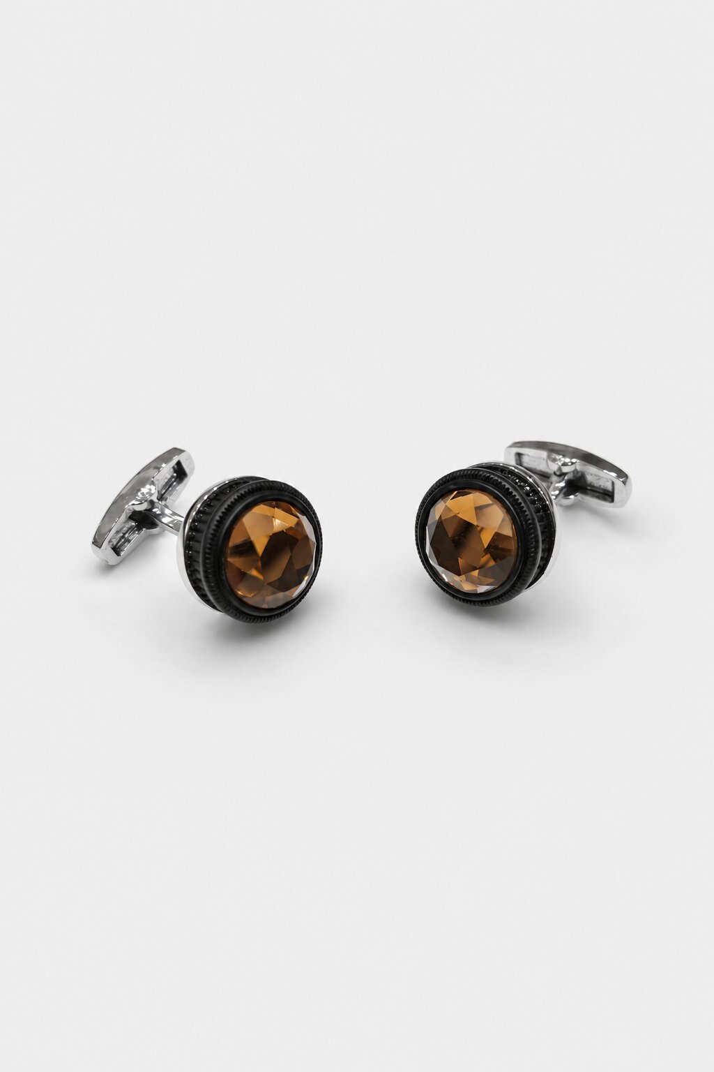 Round silver-tone cufflinks with faceted brown crystal stones for men's formal shirts.