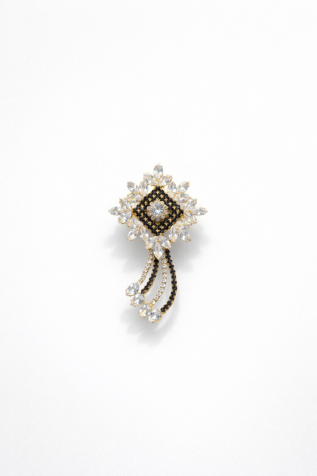 Luxury crystal brooch with clear marquise-cut stones, black crystal accents, and an elegant cascading design in a gold-tone setting.