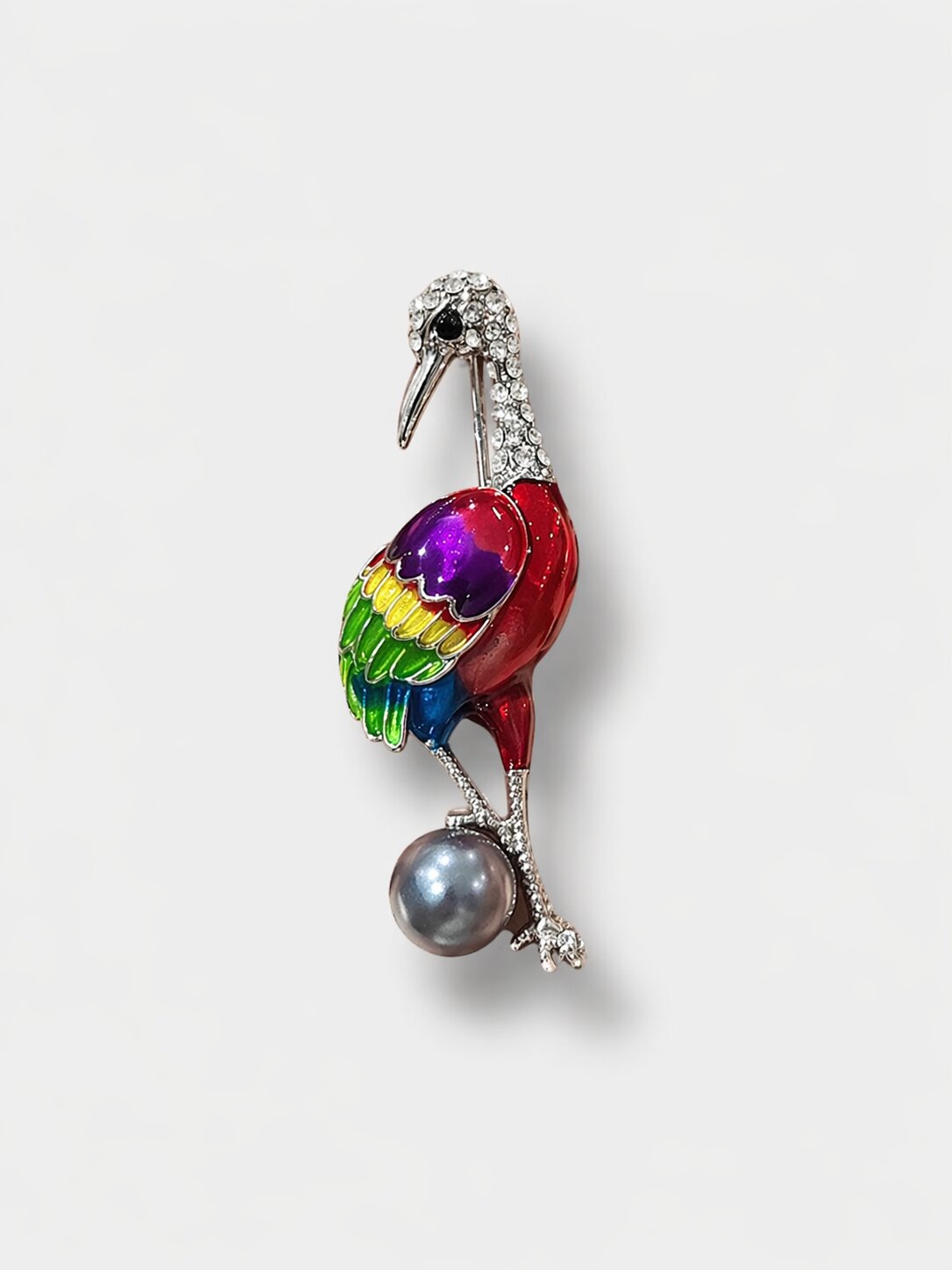 Colorful crane brooch with rainbow enamel wings, crystal detailing, and a grey pearl accent in a silver-tone setting.