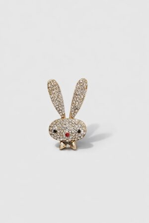 Gold-tone bunny brooch embellished with sparkling clear crystals, black crystal eyes, and a red crystal nose.