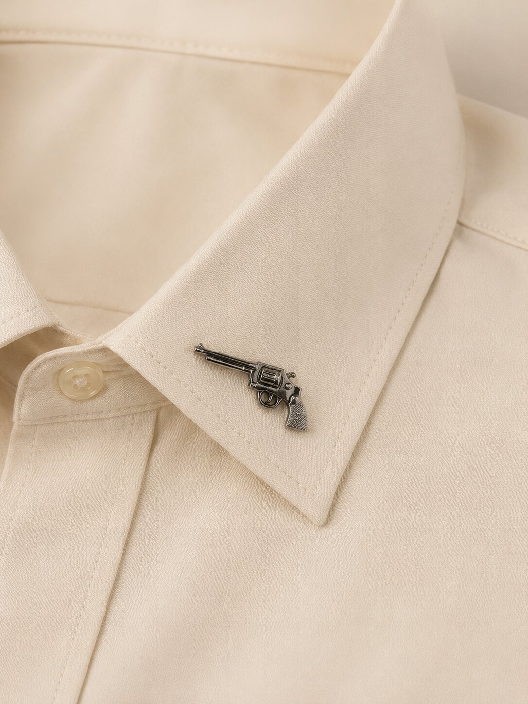 Silver revolver-shaped collar tip accessory crafted from premium stainless steel alloy with polished finish.