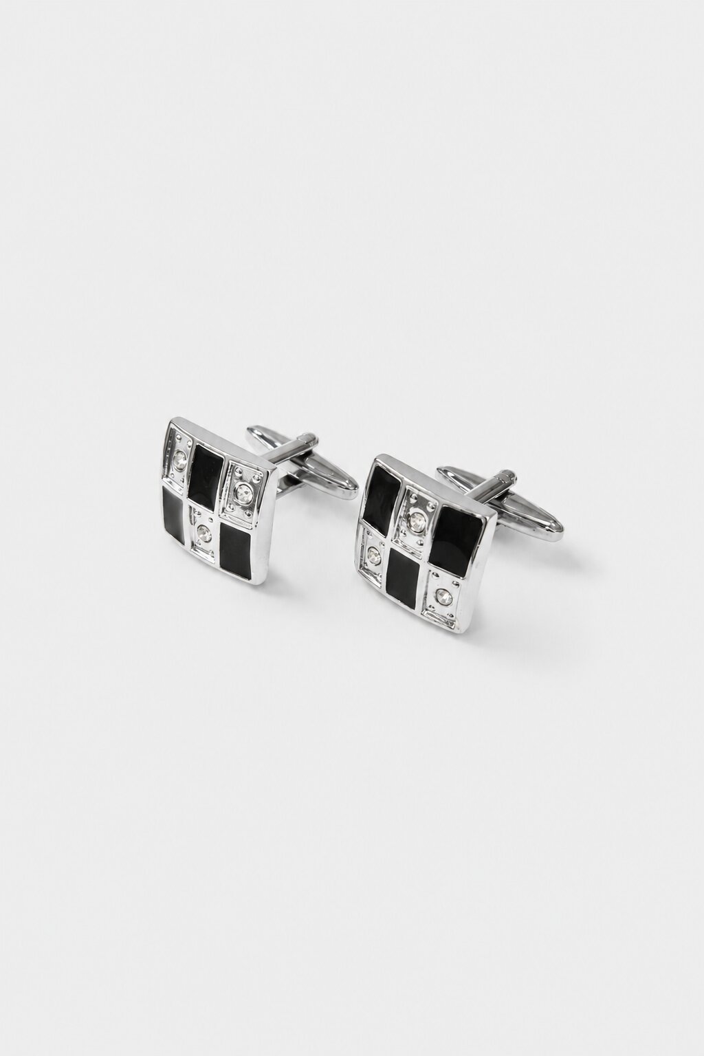 Silver square cufflinks with black geometric enamel design and crystal accents for men's formal shirts.