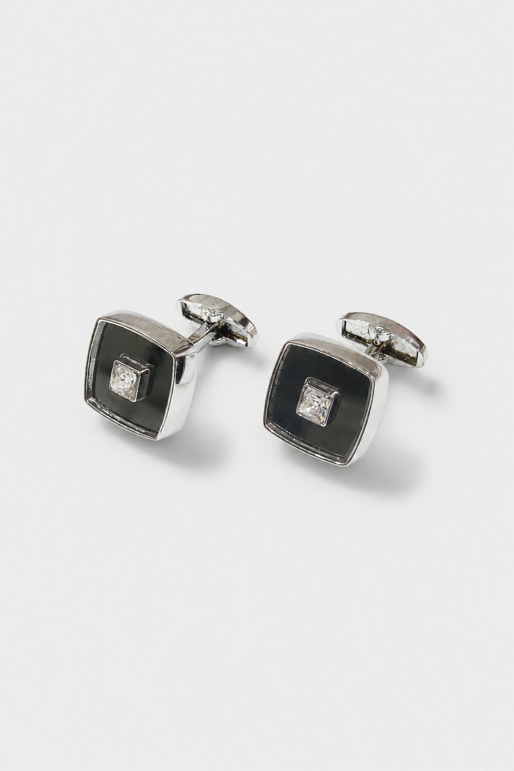 Silver square cufflinks with black enamel center and crystal accent for men's formal shirts.