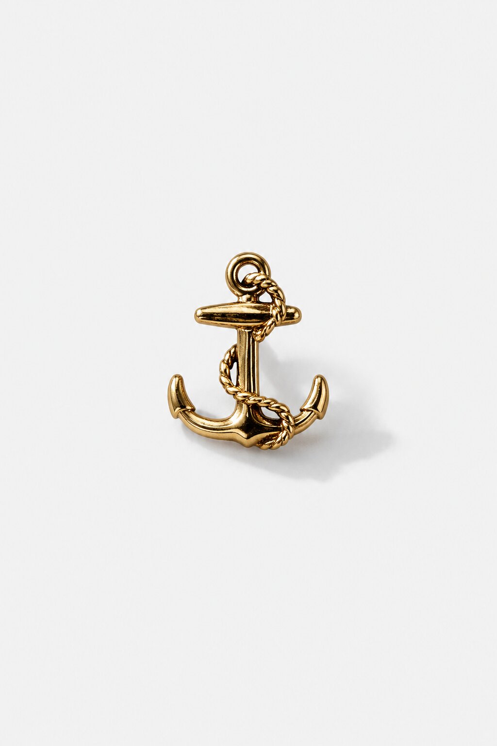 Gold nautical anchor brooch with rope detailing and polished premium finish.