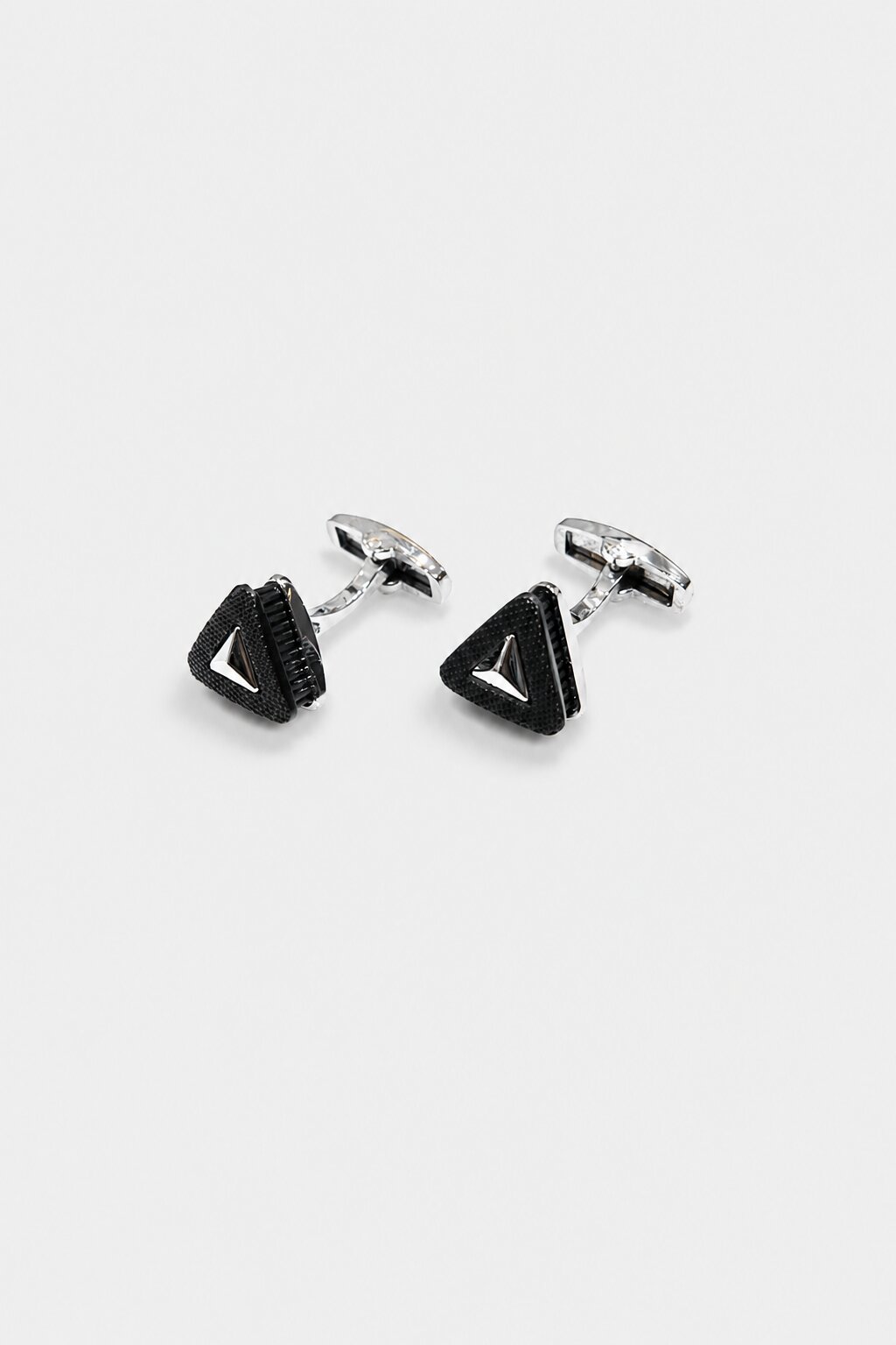 Black triangular cufflinks with textured surface and silver-tone frame for men's formal dress shirts.