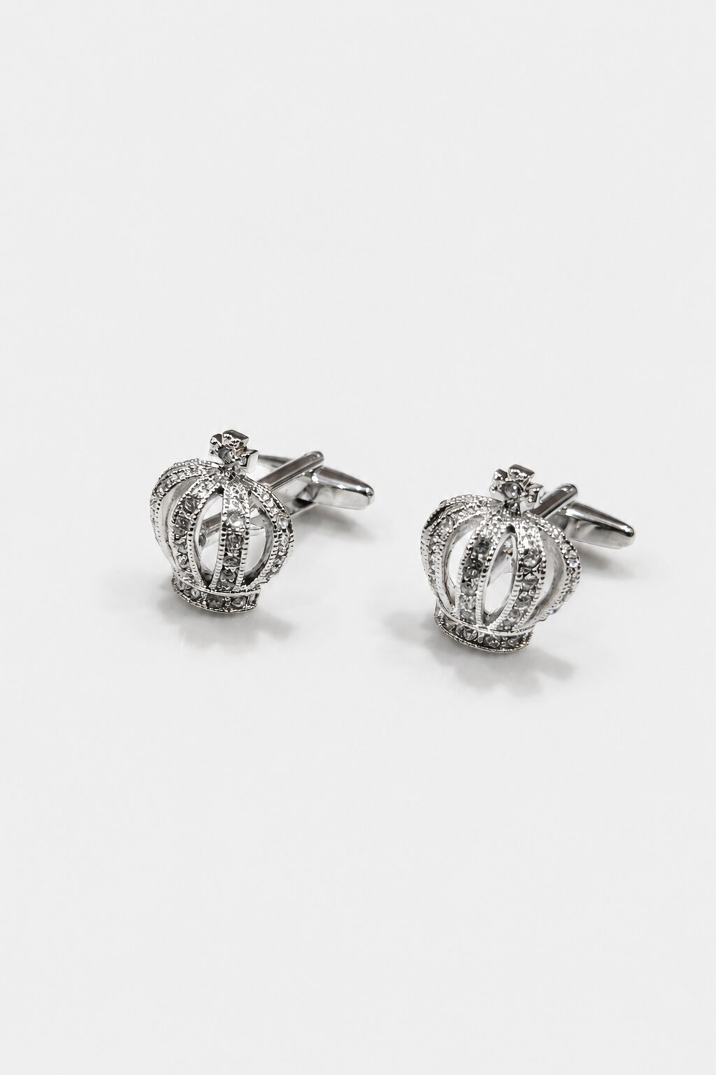 Silver crown cufflinks embellished with sparkling crystals for men's formal wear.