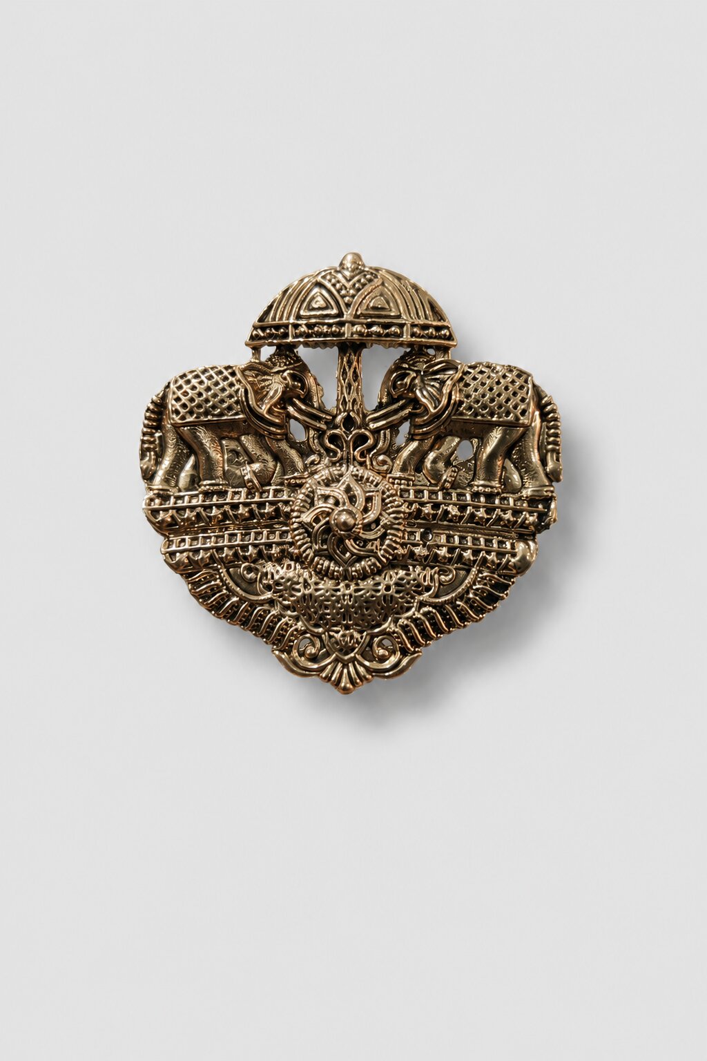 Antique gold twin elephant heritage brooch featuring two ornate elephants beneath a ceremonial canopy with intricate traditional detailing.