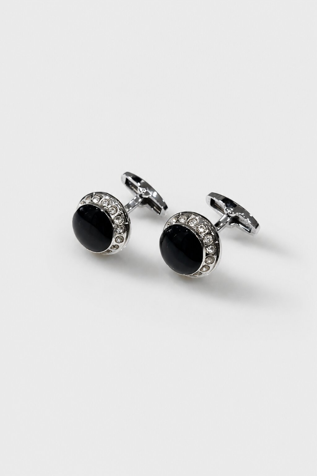 Silver-tone round cufflinks with black center stone and crystal-studded border for men's formal shirts.