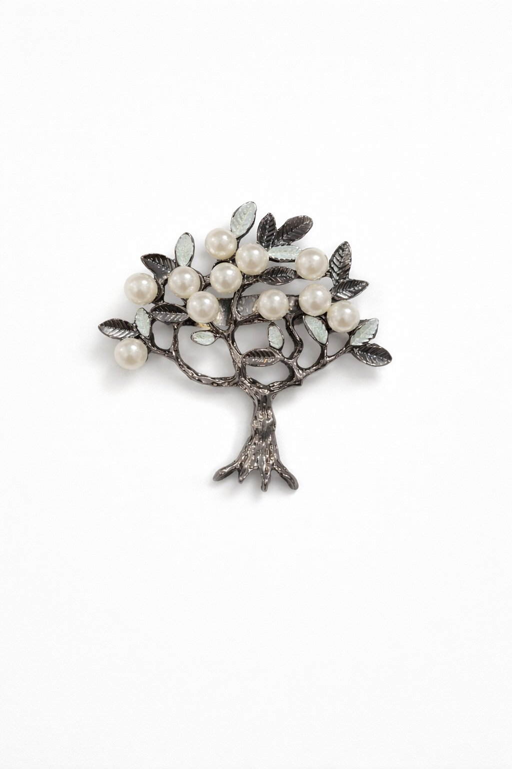 Tree-shaped brooch with ivory pearls and detailed leaf accents in an antique silver-tone finish.